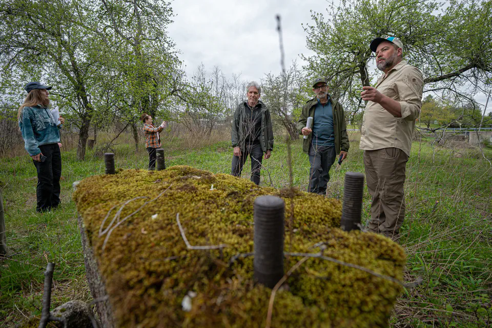 A group of people examining a potential trail corridor