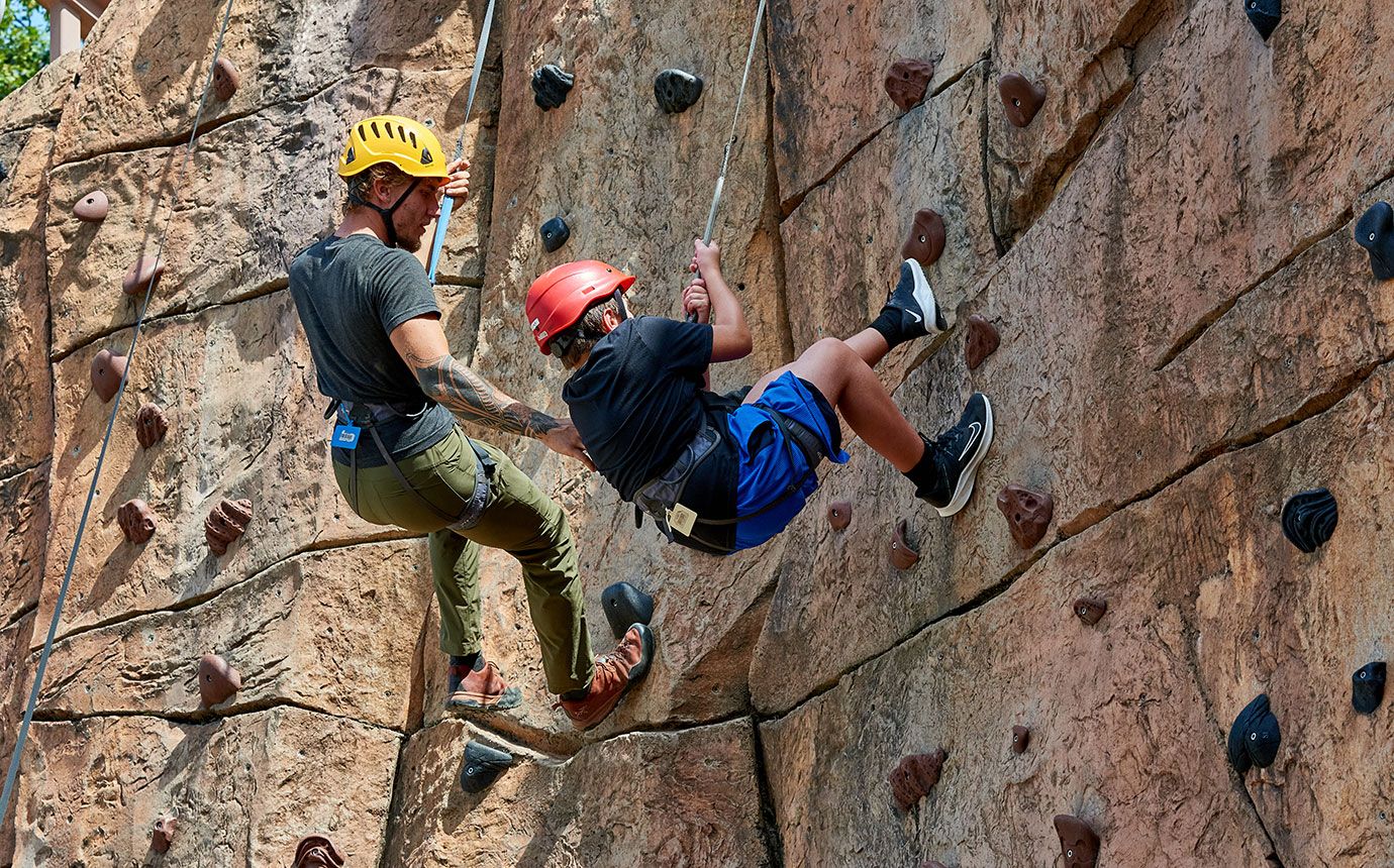 Student climbs with instructor at Science Adventure School