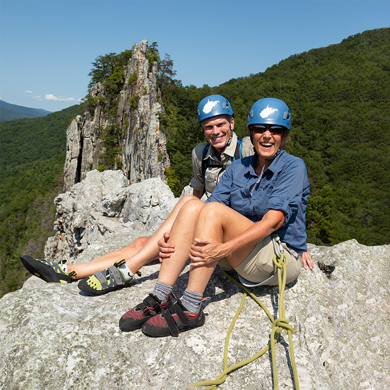 Brad and Alys waving on the summit of Seneca Rocks